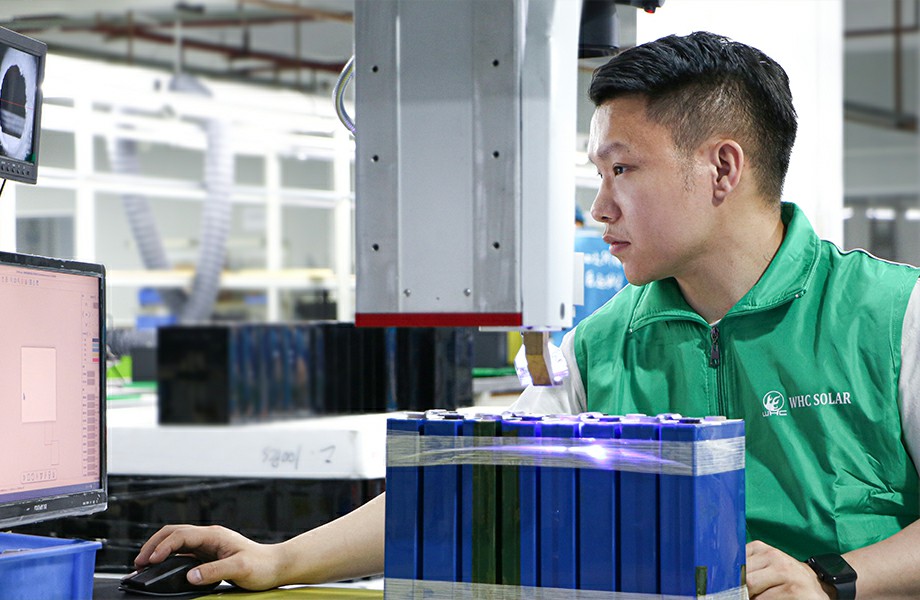 HUAYING factory worker welding a container house steel frame in the Hebei plant