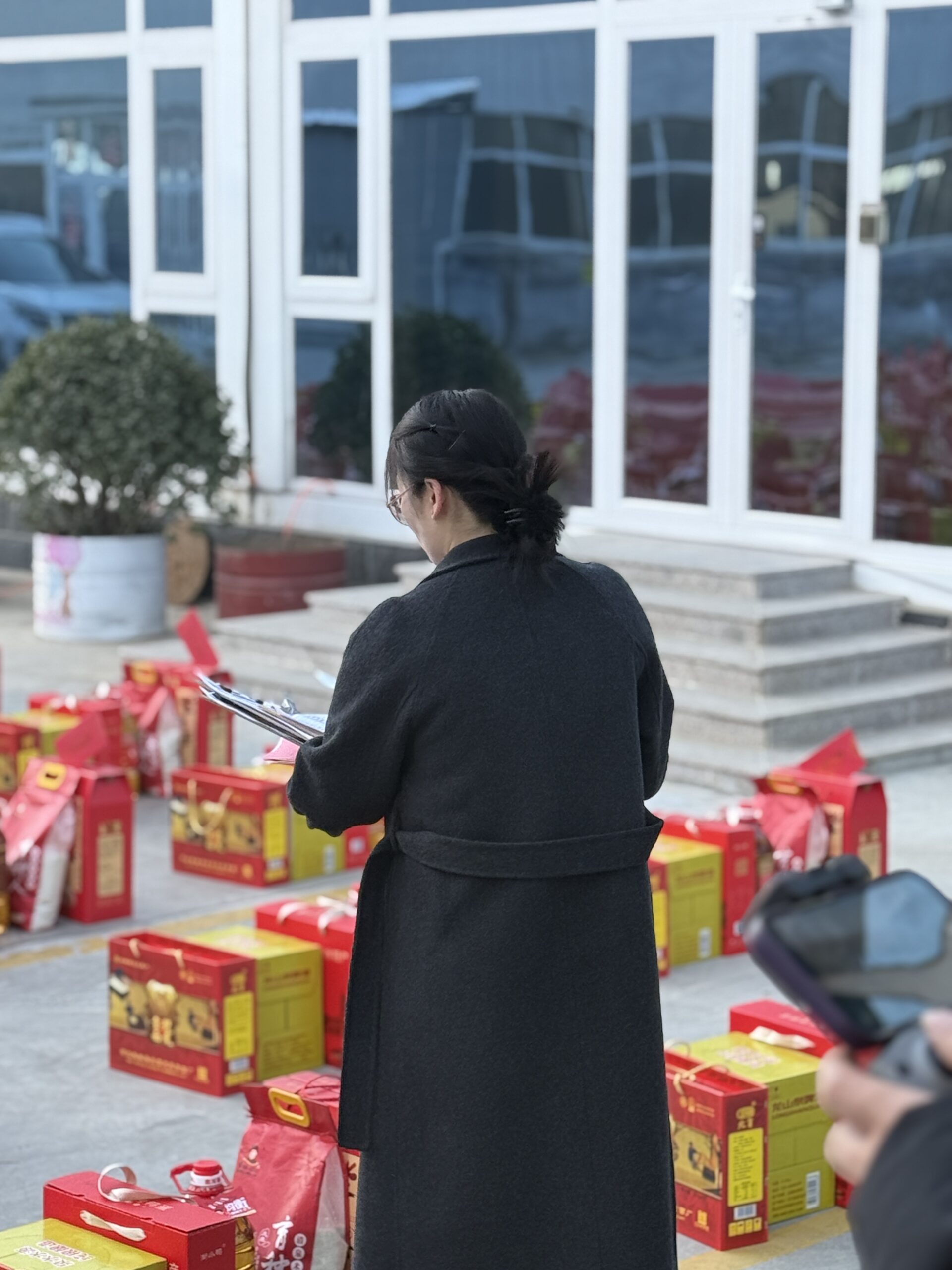 Management team distributing gifts to employees