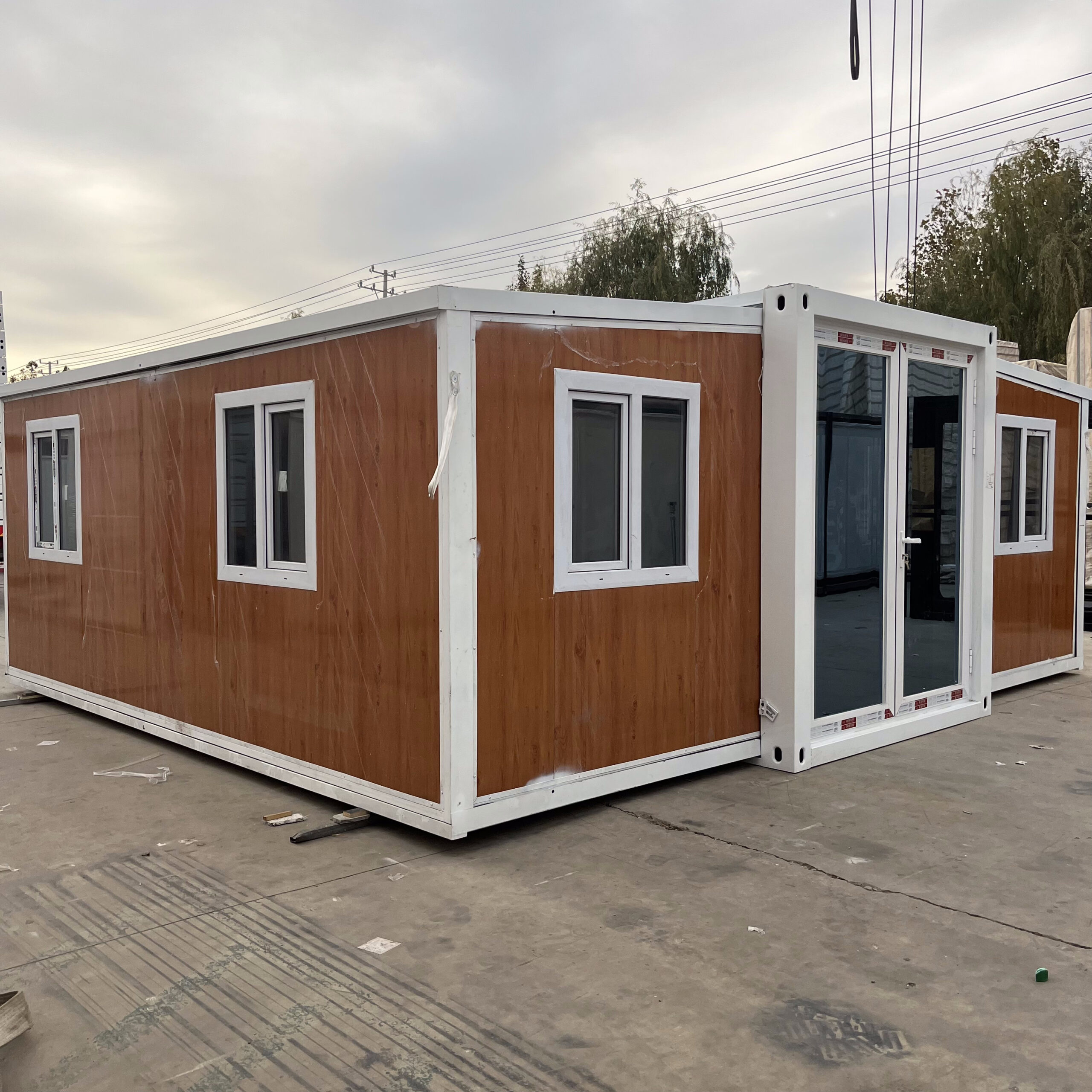 Wooden finish double-wing container house exterior