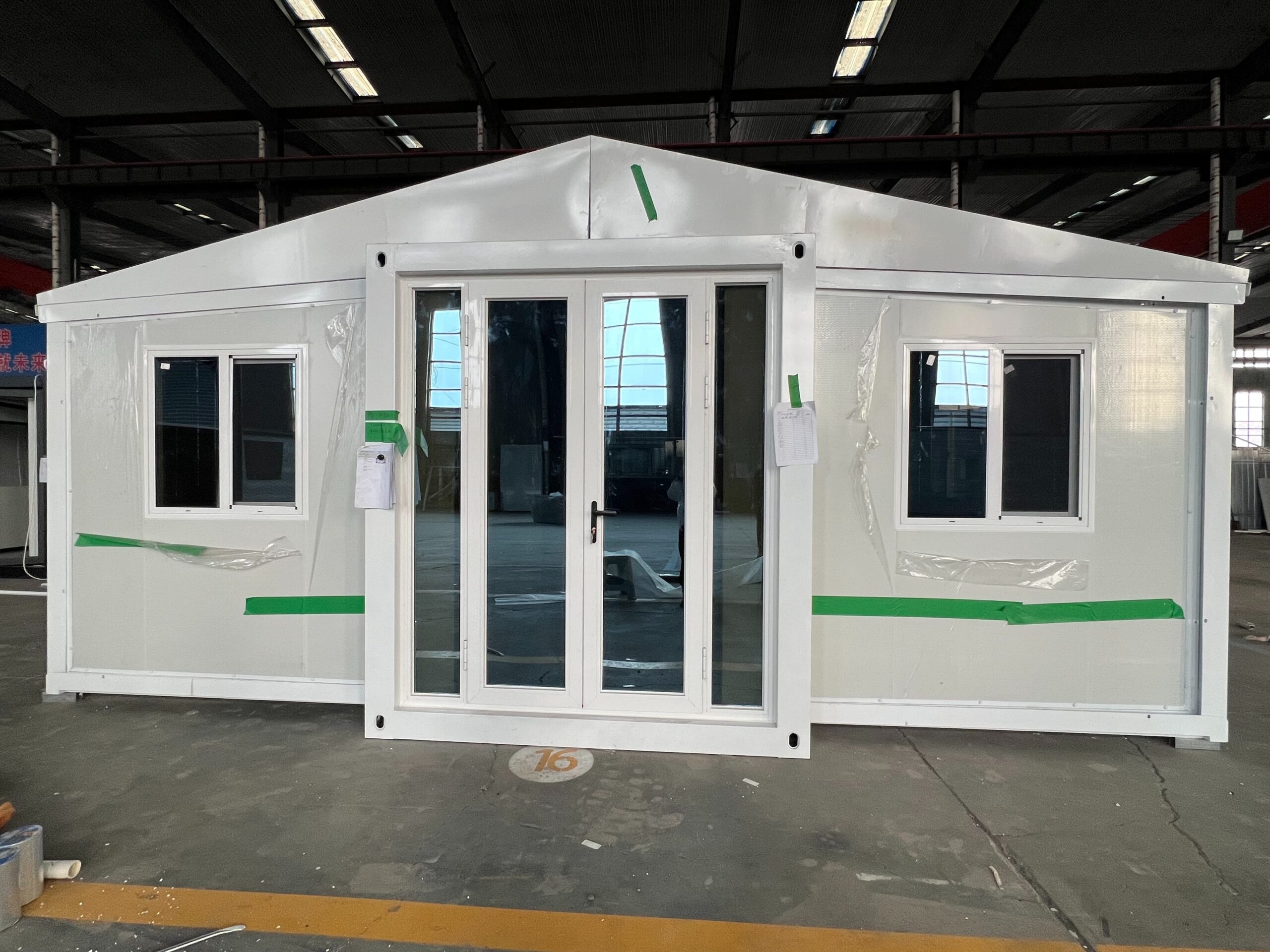 Close-up of insulated wall panels and window installation in double-wing container